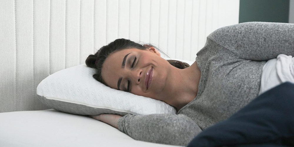A woman sleeping and smiling 