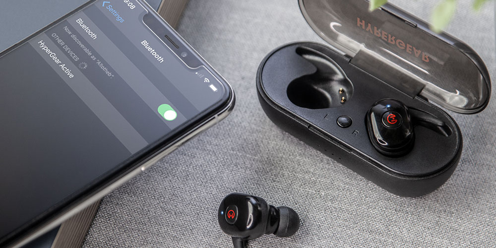 A phone and wireless earbuds